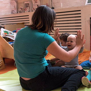 baby smiling at minihome nursery