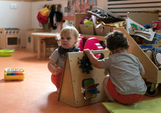 baby smiling at minihome nursery